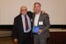 Dr. Nagib Callaos, General Chair, giving Prof. Detlev Doherr a award "In Appreciation for Delivering a Great Keynote Address at a Plenary Session."